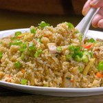 Satisfying Comfort: Close-Up of Chicken Fried Rice with Fresh Vegetables, Captured in 4K Resolution