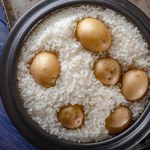 Savory Fusion: Close-Up of Steamed White Rice Cooked with Potatoes, Captured in 4K Resolution