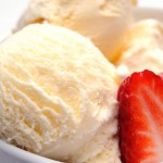 Sundae Sensation: 4K Close-Up of Vanilla Ice Cream Scoops with Fresh Strawberry Slices