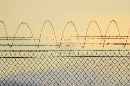 Photo for 4K Ultra HD Image of Barbed Wire at the Airport Perimeter - Royalty Free Image