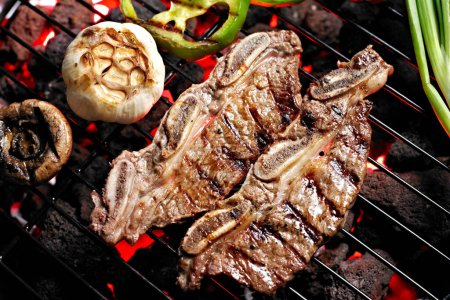 Grilled Delicacy: 4K Ultra HD Image of Short Rib on Charcoal Grill with Roasted Garlic