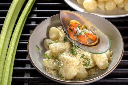 Seafood Symphony: 4K Ultra HD Image of Gnocchi in Cream Sauce, Cheese, and Seafood