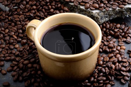 Coffee Bliss: 4K Ultra HD Image of Close-Up of Coffee Cup on Coffee Beans