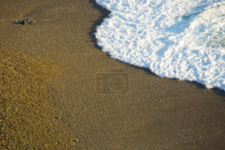 Serene Seascape: 4K Ultra HD Image of Wave on Sandy Beach with Lots of Copy Space