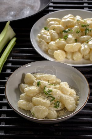 Creamy Comfort: 4K Ultra HD Image of Gnocchi in Cream Sauce and Cheese