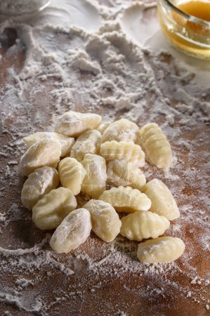 From Scratch to Savory: 4K Ultra HD View of Authentic Gnocchi Crafting on Wooden Board