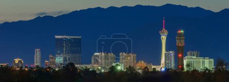 Evening Glow: 4K Ultra HD Image of Las Vegas Skyline at Dusk with Freeway Traffic