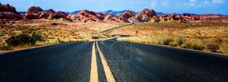 Scenic Desert Drive: 4K Ultra HD Image of Desert Road and Red Rock Formation