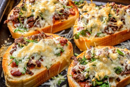 Close-Up 4K Ultra HD Image of Bruschettas with Meat, Chili Beans, and Cheese - Stock Photography