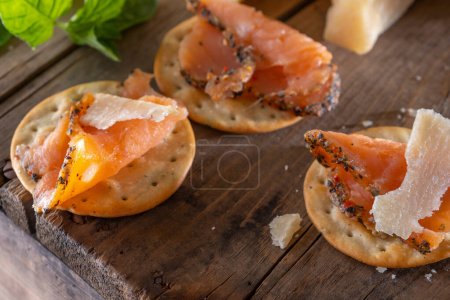 Close-Up 4K Ultra HD Image of Crackers with Smoked Salmon and Cheese - Stock Photography