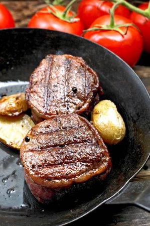 Close-Up 4K Ultra HD Image of Grilled Juicy Sirloin Steak with Potatoes - Stock Photography