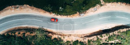 Breathtaking Aerial View: Cars Driving Through Scenic Tea Plantations in 4K image