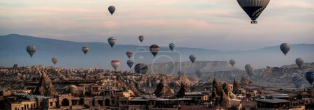 Mesmerizing Sunrise Flight: 4K Ultra HD image of Hot Air Balloons Over Cappadocia Valley