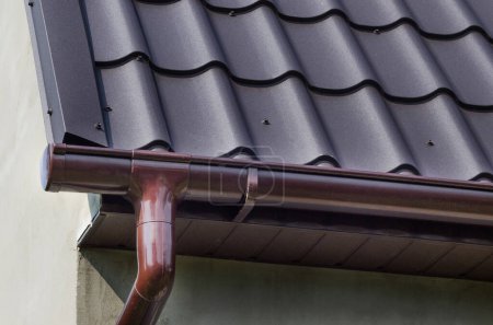 Photo for Corner of the house with gutter. Plastic gutter. - Royalty Free Image