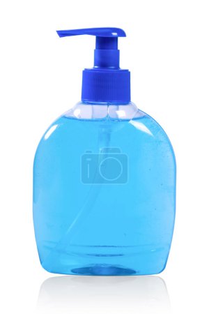 Foto de Botella de plástico con jabón líquido azul sobre fondo blanco con reflexión. - Imagen libre de derechos