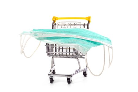Photo for Medical face masks on trolley isolated on white. Safe shopping. Healthcare and medicine concept. - Royalty Free Image