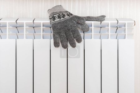Photo for Warm gloves on the radiator. Heating season concept. - Royalty Free Image