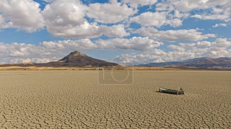 Drought, drying lake, fishing boat