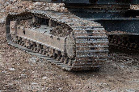 Photo for Excavator wheels on mud, dirty machine detail on mud. - Royalty Free Image