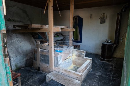 Interior view of a water mill for grinding wheat.