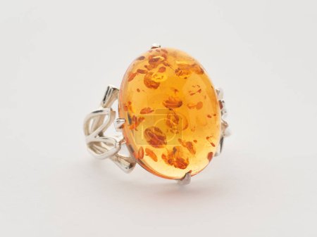 Photo for A silver ring with an amber insert - Royalty Free Image