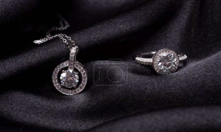 Photo for Beautiful silver set with diamonds on a black background - Royalty Free Image