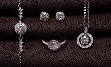 Photo for Beautiful silver set with diamonds on a dark background - Royalty Free Image