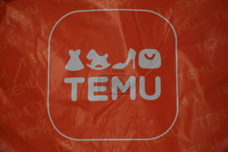 Photo for Temu orange bag package with logo on it, center frame close up - Royalty Free Image