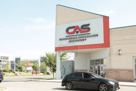 Photo for Canadian appliance source cas logo sign front of store with road next to it and car vehicle passing in front - Royalty Free Image