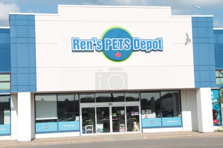 Photo for Rens pets depot front store entrance storefront facade with logo sign pillars glass doors exterior outside with sky behind - Royalty Free Image