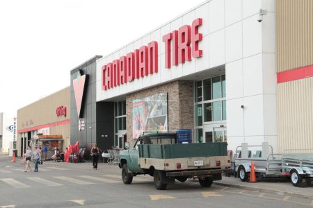 Photo for Canadian tire store with vehicle parked in front and customers people walking with sign and logo entrance - Royalty Free Image