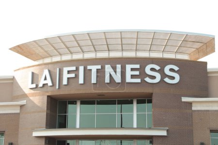 Photo for La fitness gym building that says la fitness on its front in summer exterior outside with windows below - Royalty Free Image