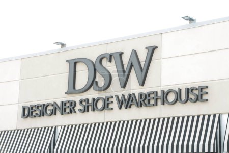 Photo for Dsw designer shoe warehouse writing caption text sign logo on front of store exterior outside in black, close up - Royalty Free Image