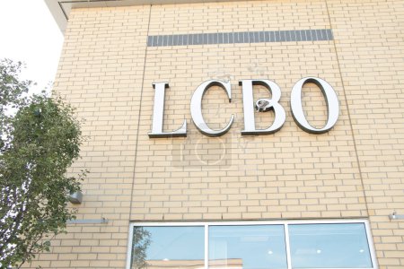 Photo for Lcbo liquor control board of ontario logo sign letters writing text on side of store in white with tree - Royalty Free Image