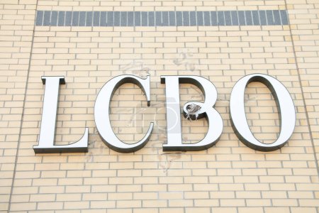 Photo for Lcbo liquor control board of ontario logo sign letters writing text on side of store in white, close up - Royalty Free Image
