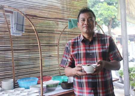 Photo for Pekalongan, Indonesia - June 26, 2023 : Man prepared soto order for consumen. - Royalty Free Image