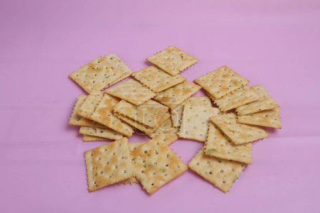 Photo for Crackers biscuits isolated on pink background - Royalty Free Image