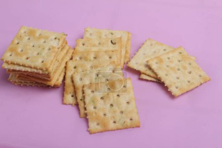 Photo for Crackers biscuits isolated on pink background - Royalty Free Image