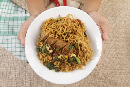 Photo for A bowl of fried noodles with sausage - Royalty Free Image