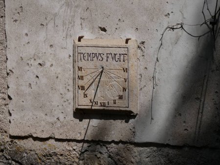 Photo for Tempus fugit, time flies, philosophy on a sundial - Royalty Free Image