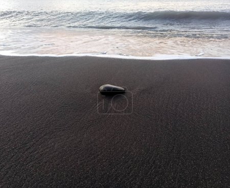 Photo for Black stone, black sand, volcanic beach of Saint Paul, Zen background, Reunion - Royalty Free Image
