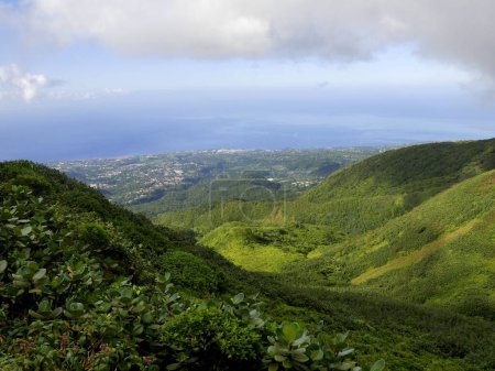 landscape photo of basse terre west coast seen from soufriere mountain, guadeloupe