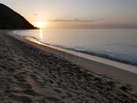 scenic sunset beach landscape in deshaies, grande anse , guadeloupe, french antilles