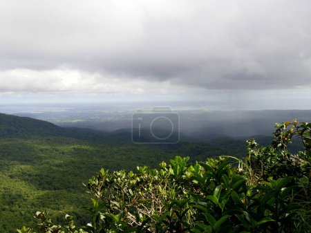 rain falling over guadeloupe hills seen from route de la traversee, basse terre