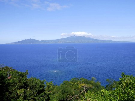 Basse Terre in guadeloupe seen from les Saintes, ocean and soufriere volcano in the cloud. Landscape