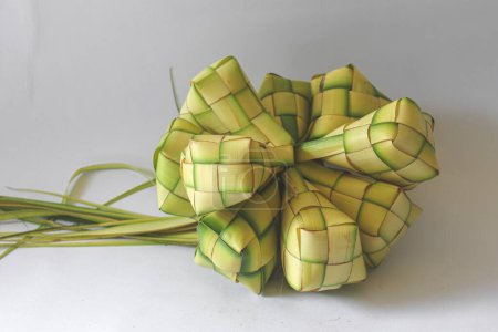 Photo for A bundle of ketupat close up picture on white background, ketupat is a traditional food - Royalty Free Image
