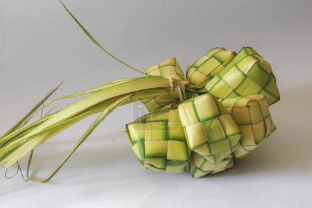 Photo for Closeup photo of ketupat, ketupat is a traditional food like cake of rice made from coconut leaves for shell - Royalty Free Image
