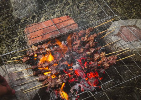 Photo for Grilled beef and lamb satay on the grill, simple traditional food photography - Royalty Free Image