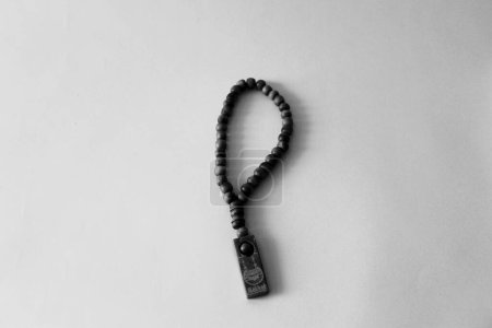 Photo for Monochrome picture of rosary on white blank background - Royalty Free Image