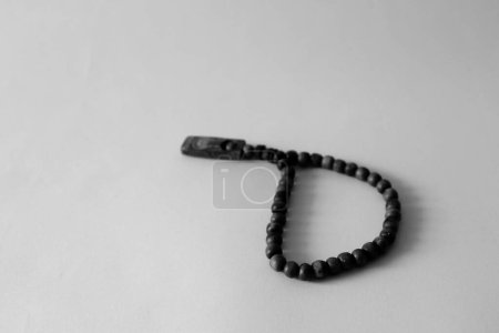 Photo for Close up rosary picture on white background and monochrome style - Royalty Free Image